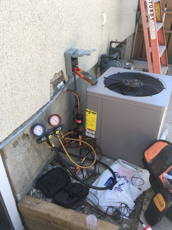 Saddle Ridge, AB - Installing 2.4 ton condenser  Saddle Ridge, AB - Installing 2.4 ton condenser